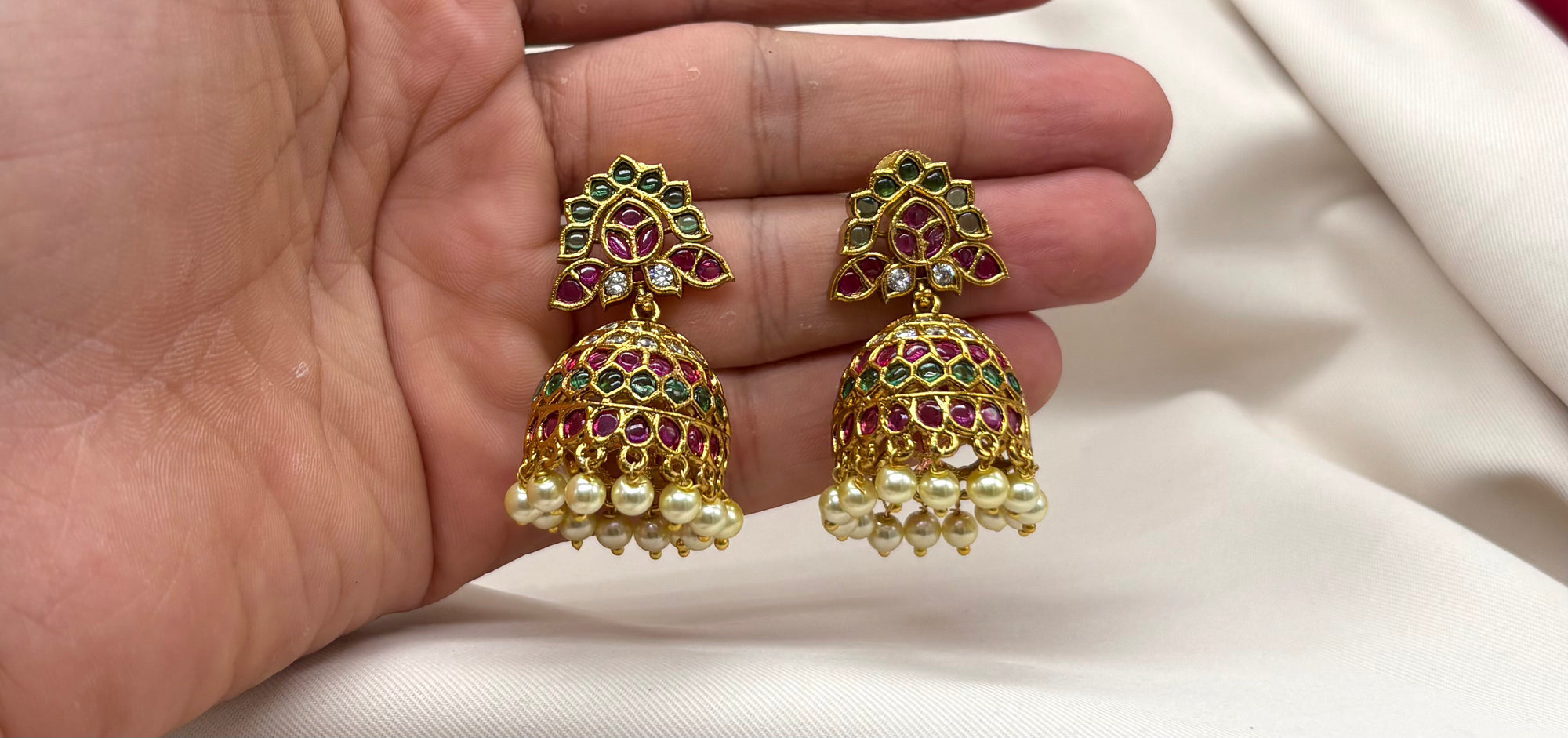 kempu jhumka green stones, accented with pearl hangings Earrings