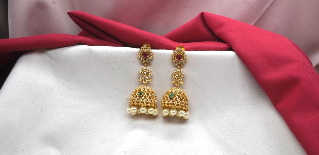 Matte finishing American Diamonds with white pearls Jhumkas Earring