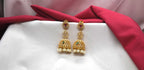 Matte finishing American Diamonds with white pearls Jhumkas Earring