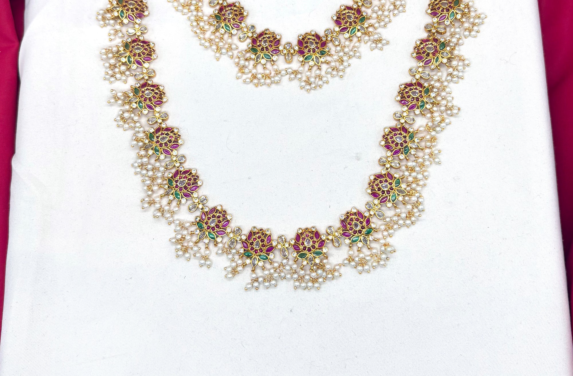 Beautifully designed with Lotus flowers and Guttapusalu clustered pearls Combo set