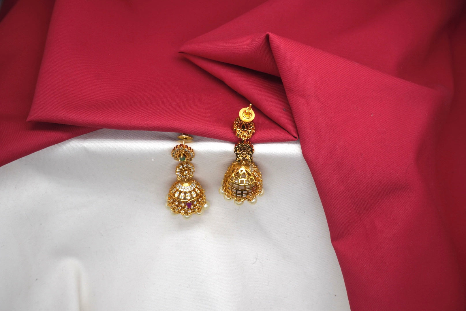 Matte finishing American Diamonds with white pearls Jhumkas Earring