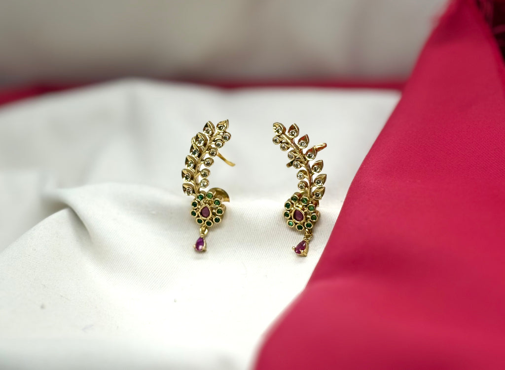 Matte finishing leaf design American diamonds with green stones earrings