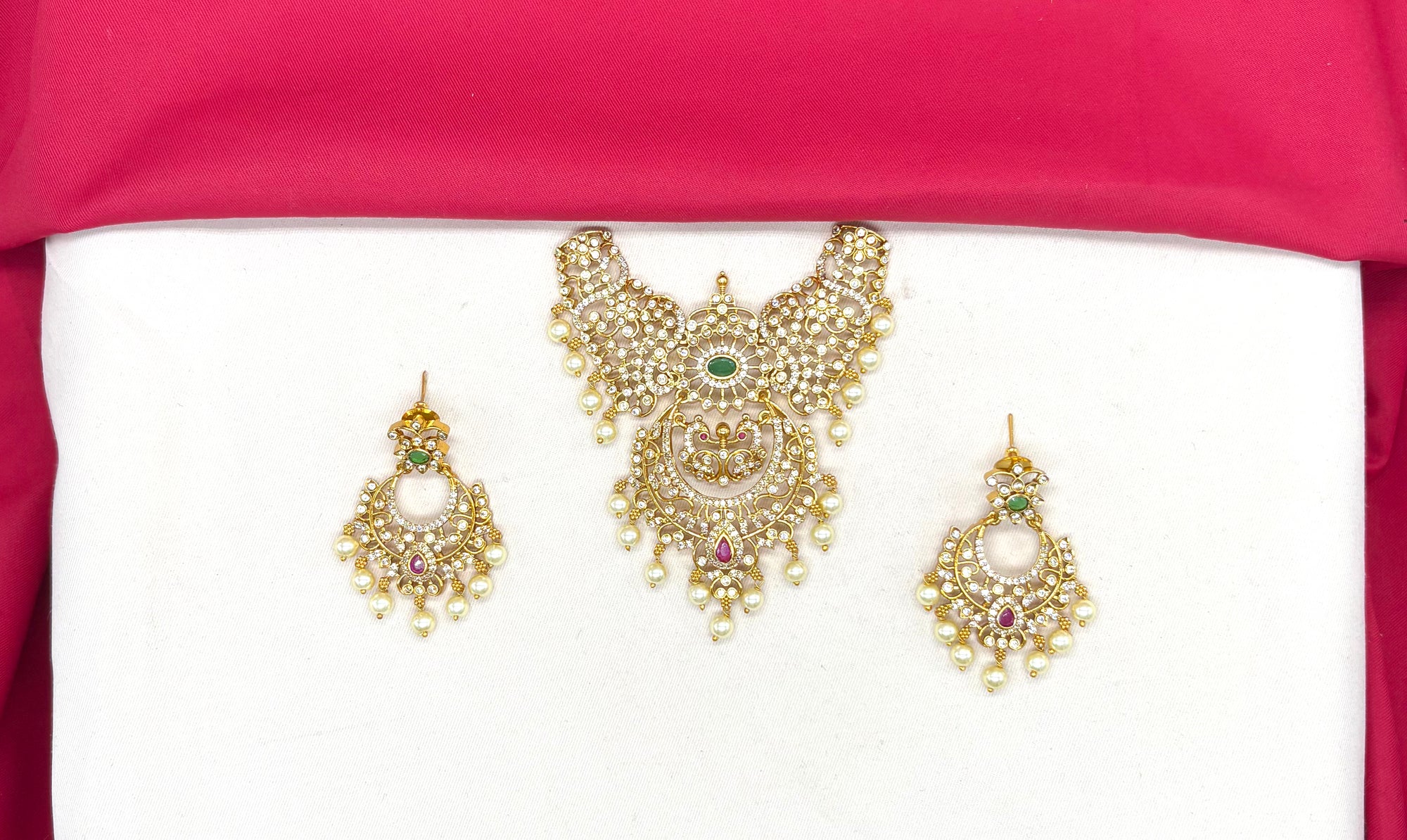 Matte finishing with floral design and pink and green stones Locket