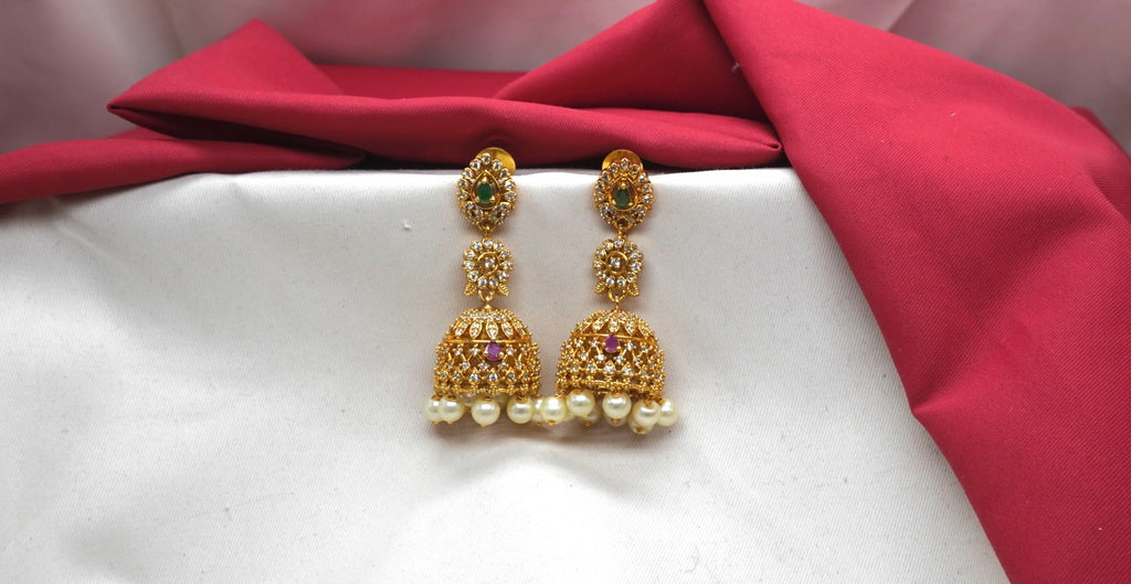 Matte finishing American Diamonds with white pearls Jhumkas Earring