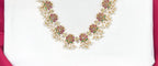 Beautifully designed with Lotus flowers and Guttapusalu clustered pearls Long Haram Necklace