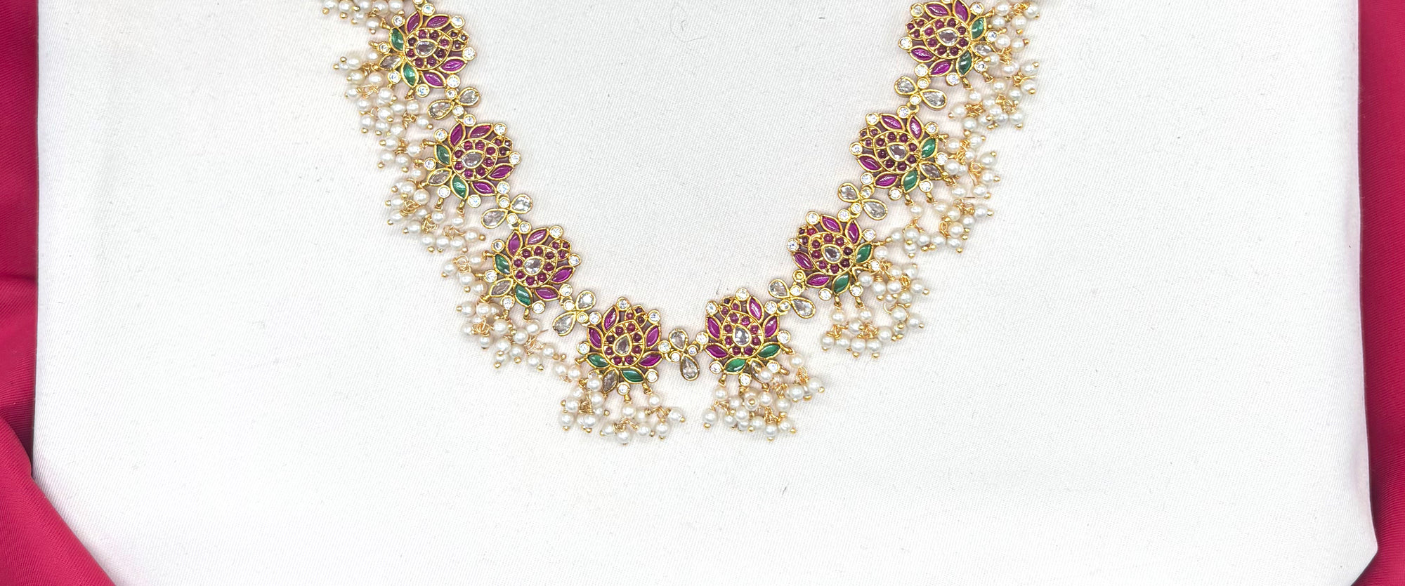 Beautifully designed with Lotus flowers and Guttapusalu clustered pearls Long Haram Necklace