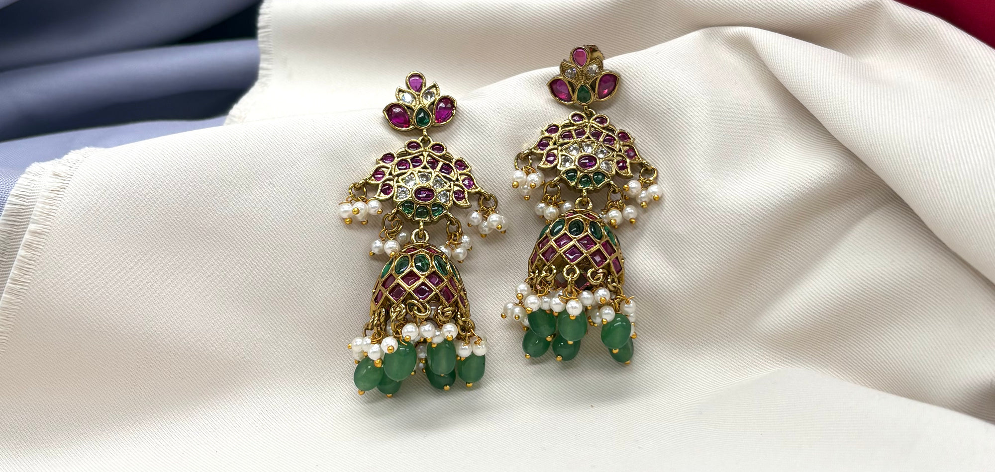 kempu stone jhumka with green beads and pearl hangings Earrings