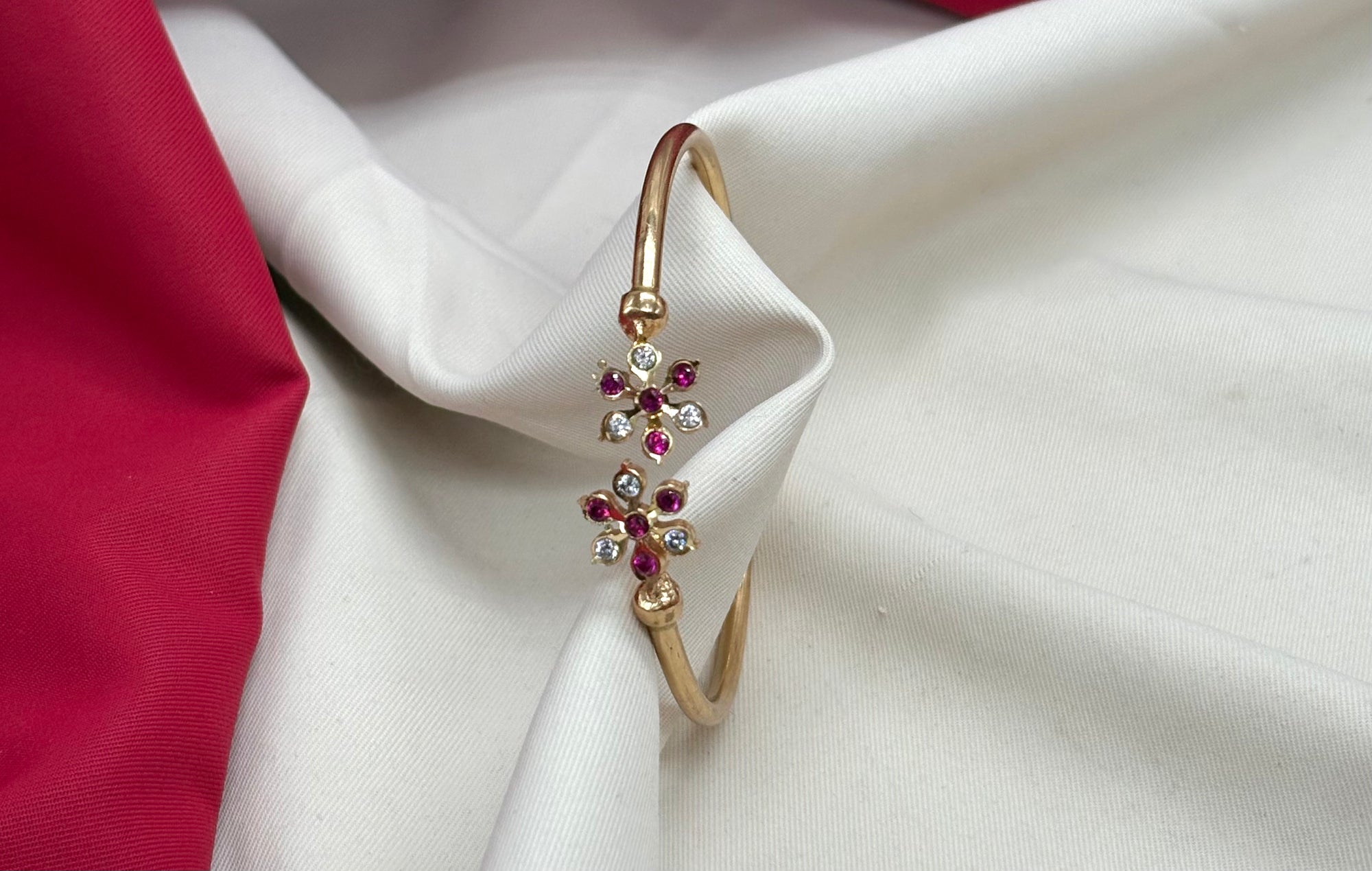Adjustable Panchaloha kada floral design with white and ruby stones