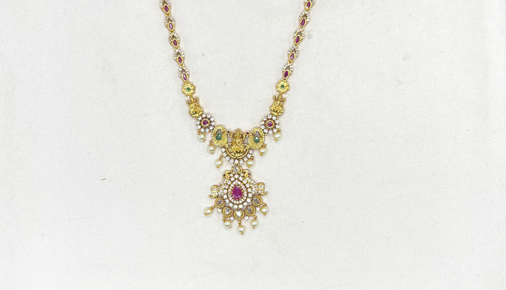 Matte finishing lord Lakshmi with pink stones and peacock finish Long haram