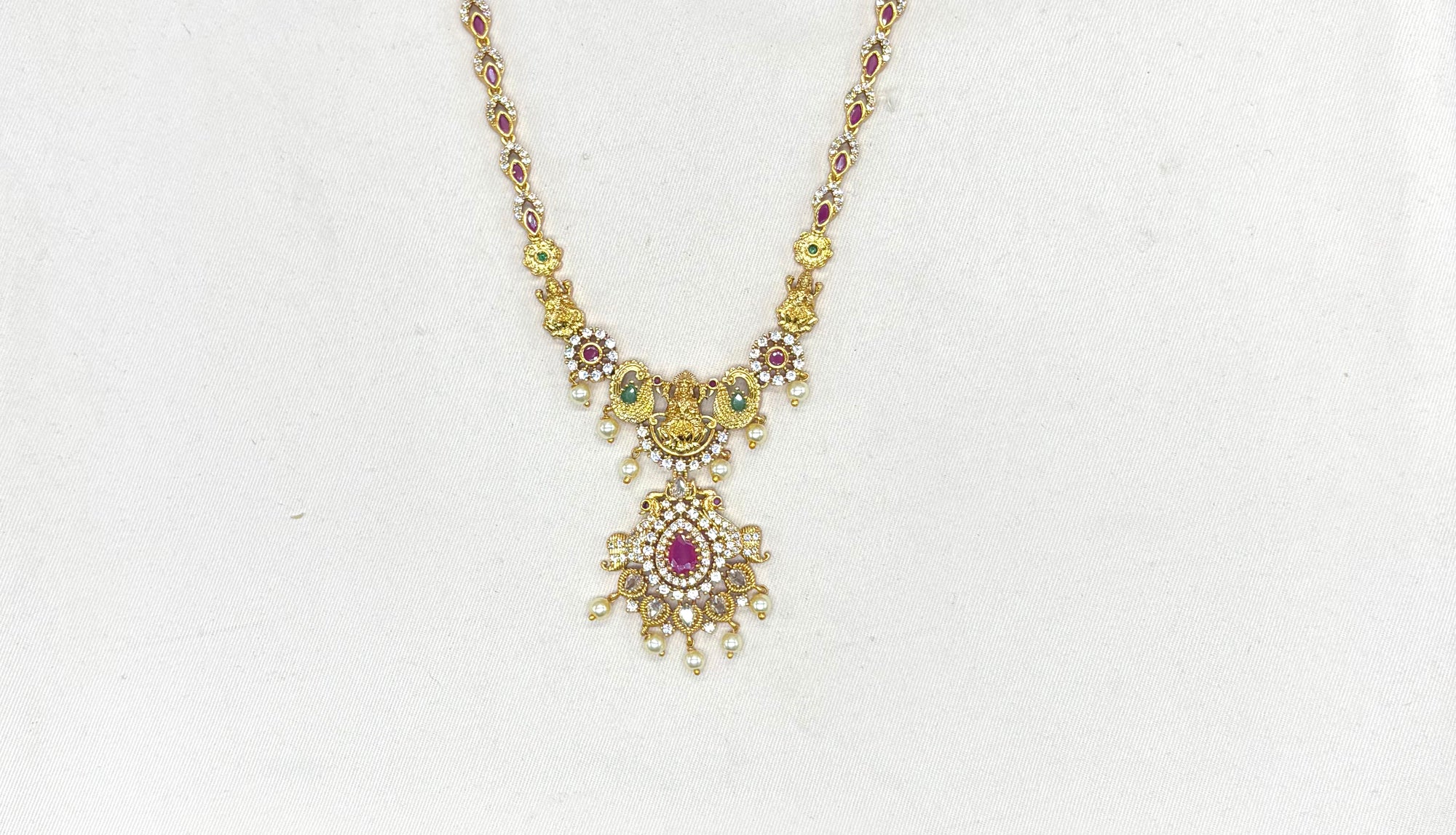 Matte finishing lord Lakshmi with pink stones and peacock finish Long haram