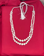 white double-layered pearl mala with a silver adjustable drawstring closure