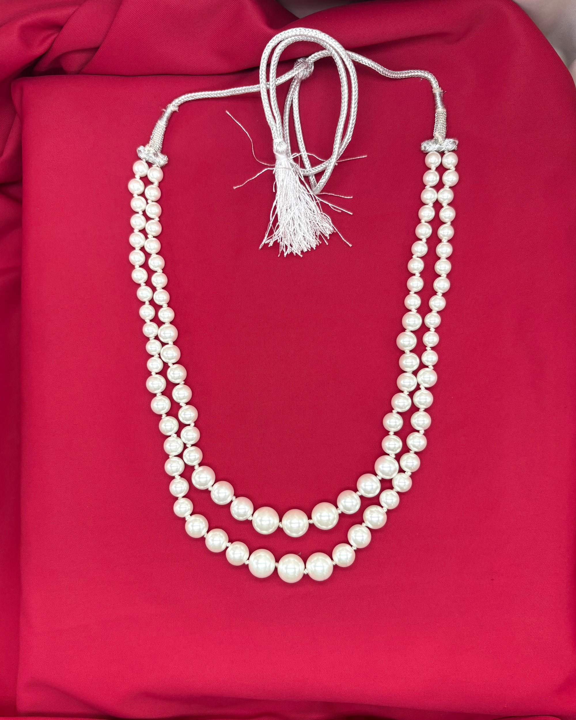 white double-layered pearl mala with a silver adjustable drawstring closure