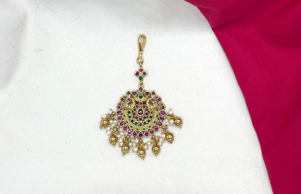 Matte finishing peacock design pink & green stones with Golden balls Maang Tikka