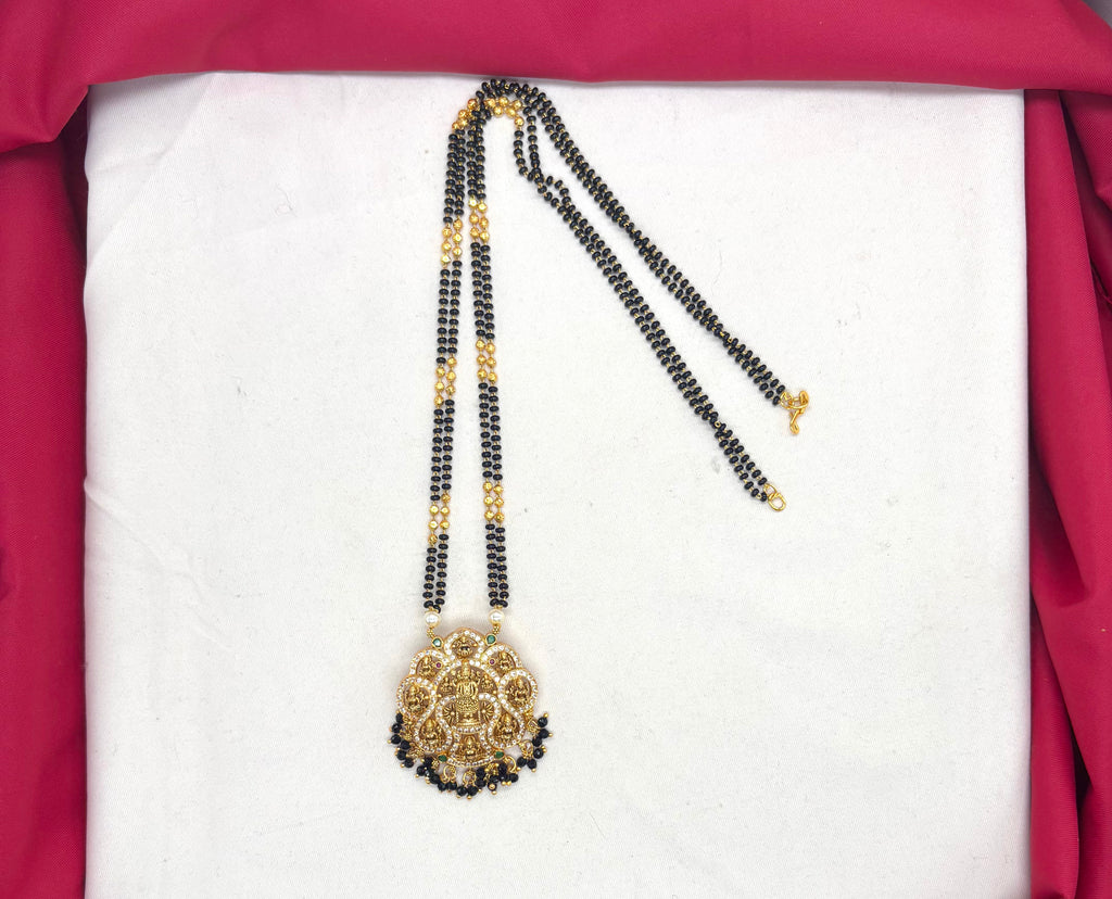 Lakshmi Devi pendant features a double chain of Black Beads