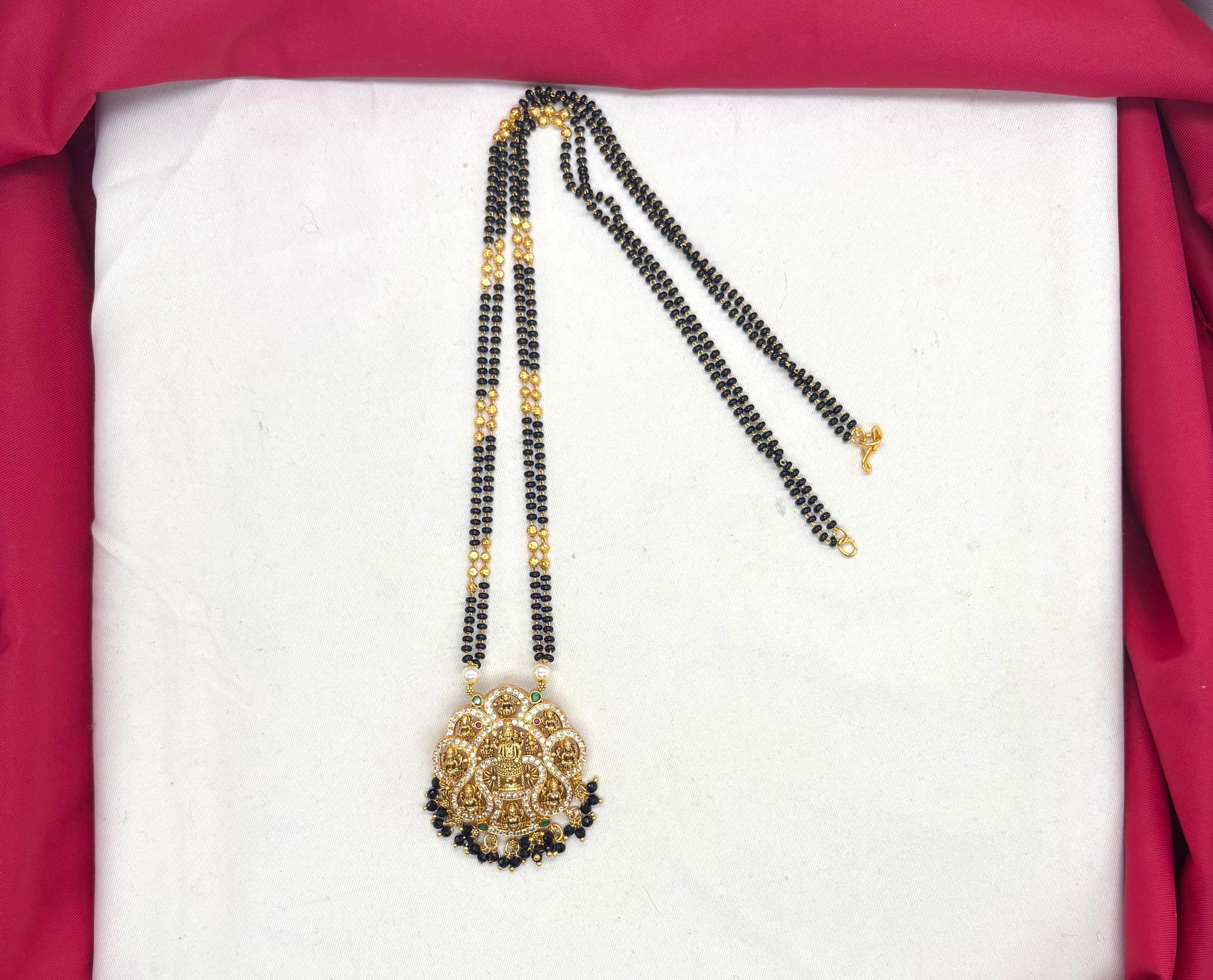 Lakshmi Devi pendant features a double chain of Black Beads