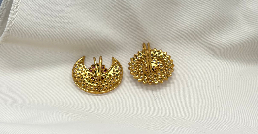 gold-plated sun and moon (Surya Chandra) featuring red and green Kemp stones.