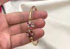 Adjustable Panchaloha kada floral design with white and ruby stones