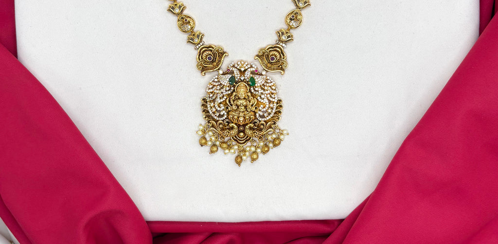 Matte finishing Goddess Lakshmi pendant, green stones, and pearl drops Short Necklace