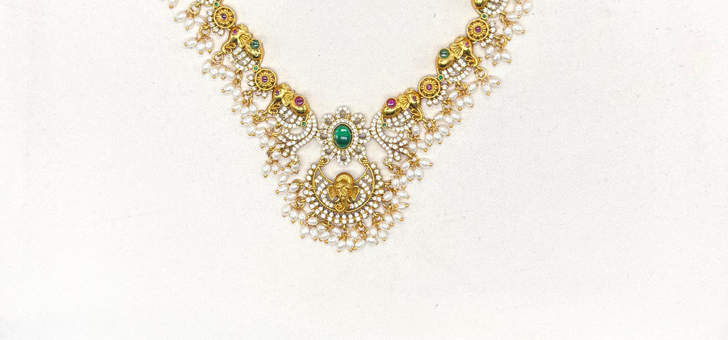 Gold finishing Lord Ganesha Pendant with Elephant design and Ad stones Short Necklace