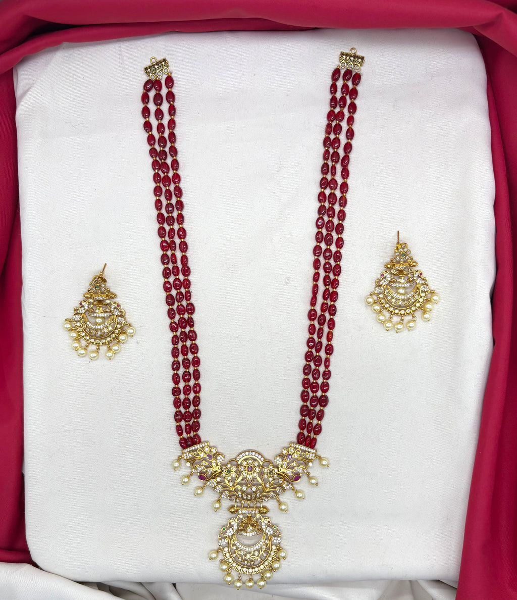 Elegant Red beads paired with a traditional, gold-finished pendant Necklace