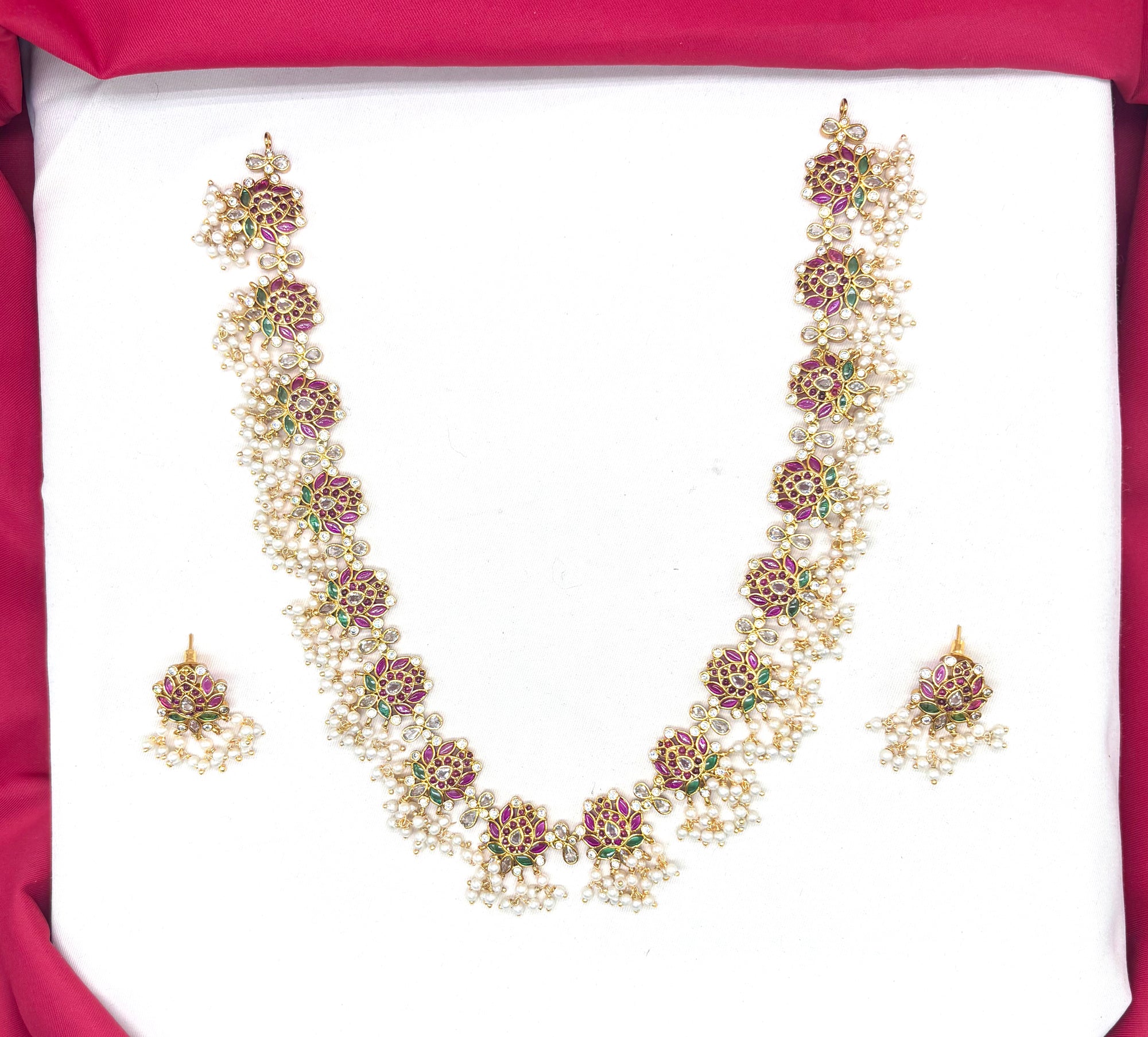 Beautifully designed with Lotus flowers and Guttapusalu clustered pearls Long Haram Necklace