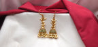 Matte finishing Green stones with cluster of pearls Jhumka earrings