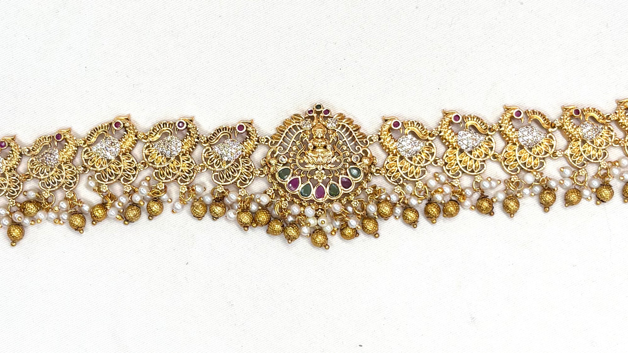 Matte finishing peacock design with multi-stones chain vaddanam