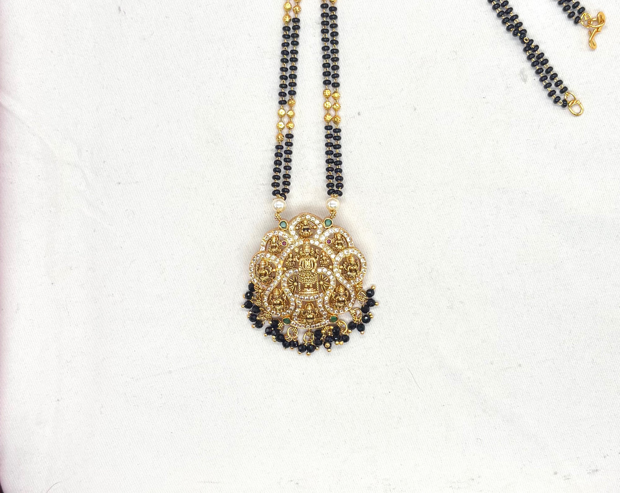 Lakshmi Devi pendant features a double chain of Black Beads