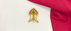 Gold Puligoru tiger nail, accented with rubies, emeralds, and a pearl drop Locket