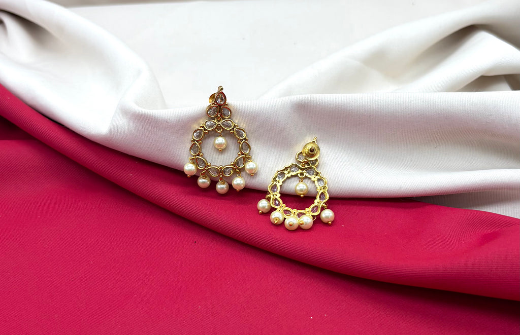 Matte finishing Ad stone pearls chandbali earrings.