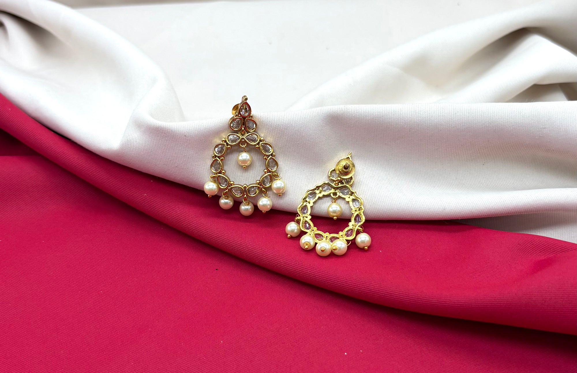 Matte finishing Ad stone pearls chandbali earrings.