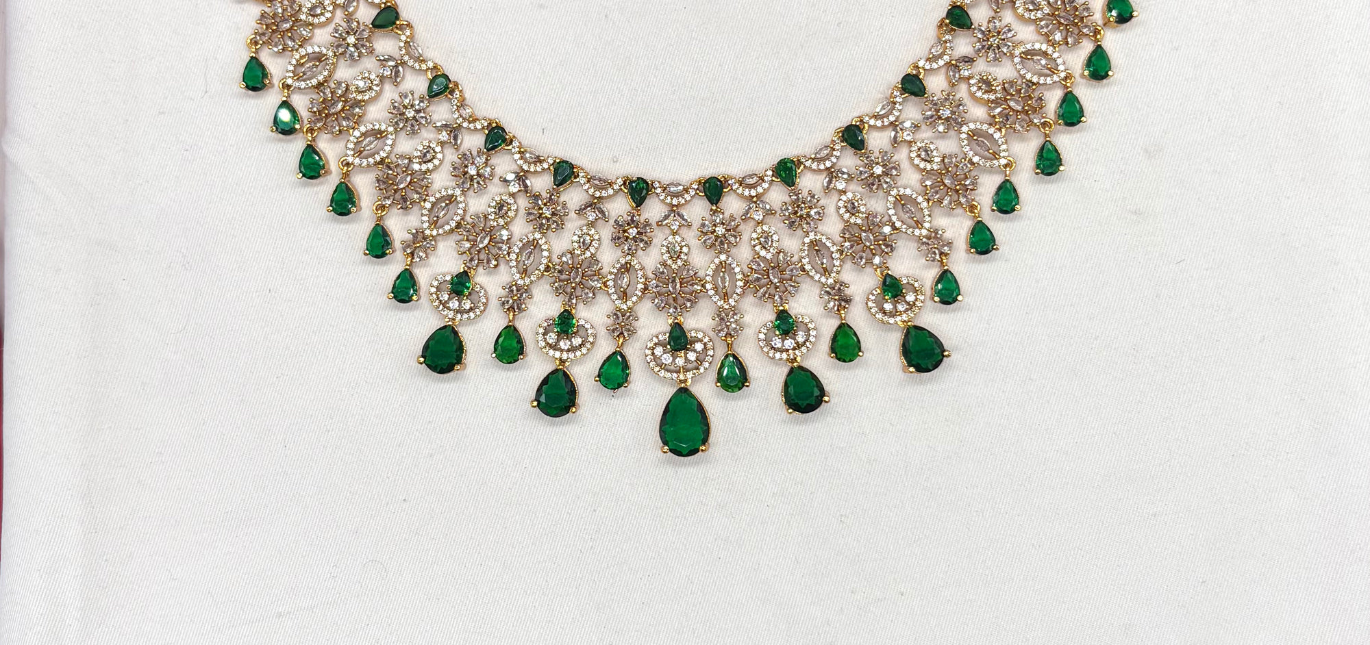 Premium matte finish American Diamonds flower design with Green Stones Short Necklace