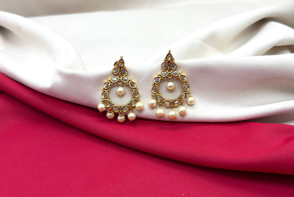 Matte finishing Ad stone pearls chandbali earrings.