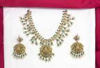 Jadau Kundan Beautifully designed with White pearls Lord Lakshmi pendant Short Necklace