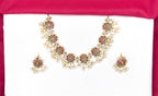 Beautifully designed with Lotus flowers and Guttapusalu clustered pearls Short Haram