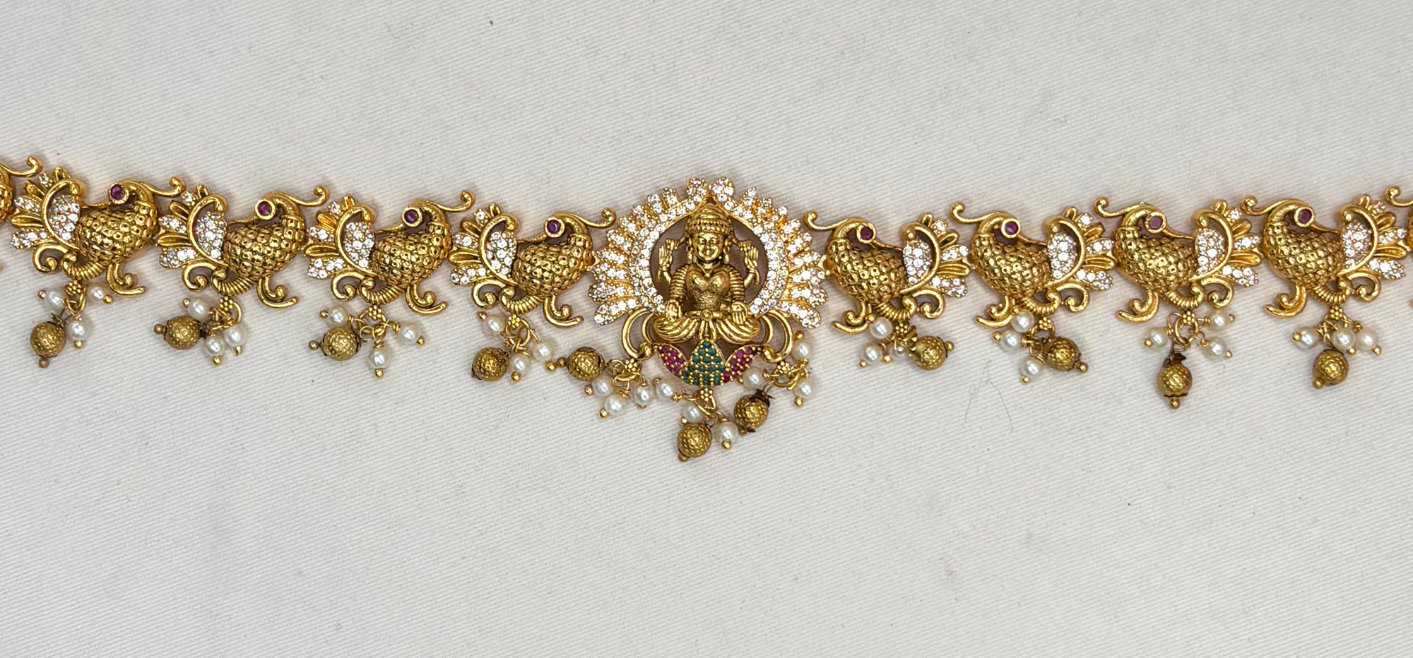 Matte finishing lord Lakshmi with AD stones Peacock design Chain Vaddanam