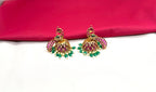 Matte finishing peacock-inspired pink Gemstones and pearl drops Jhumka’s