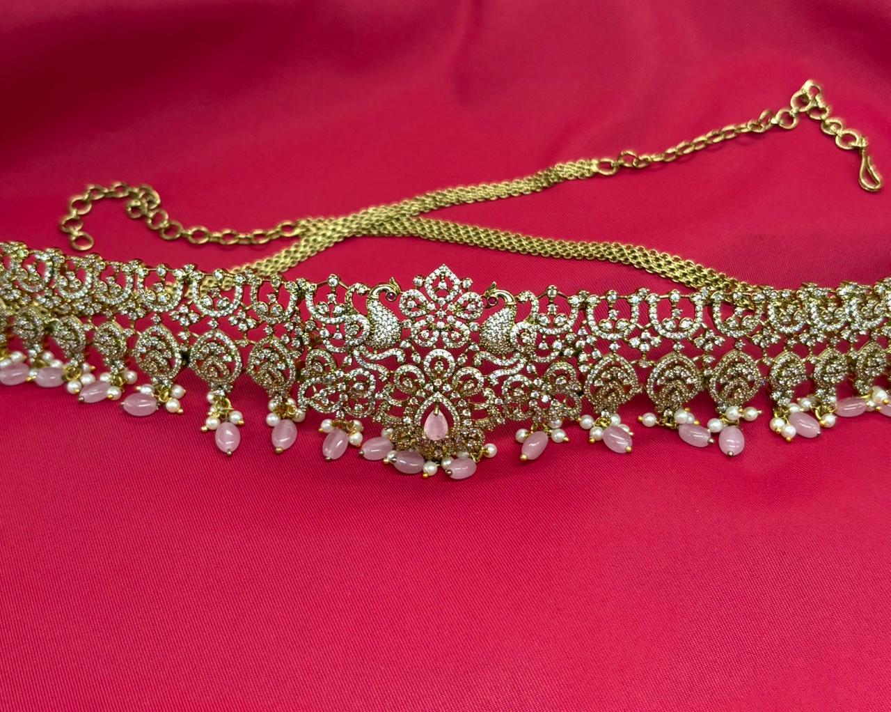 Victorian finishing with pink stones and peacock deigned  Vaddanam
