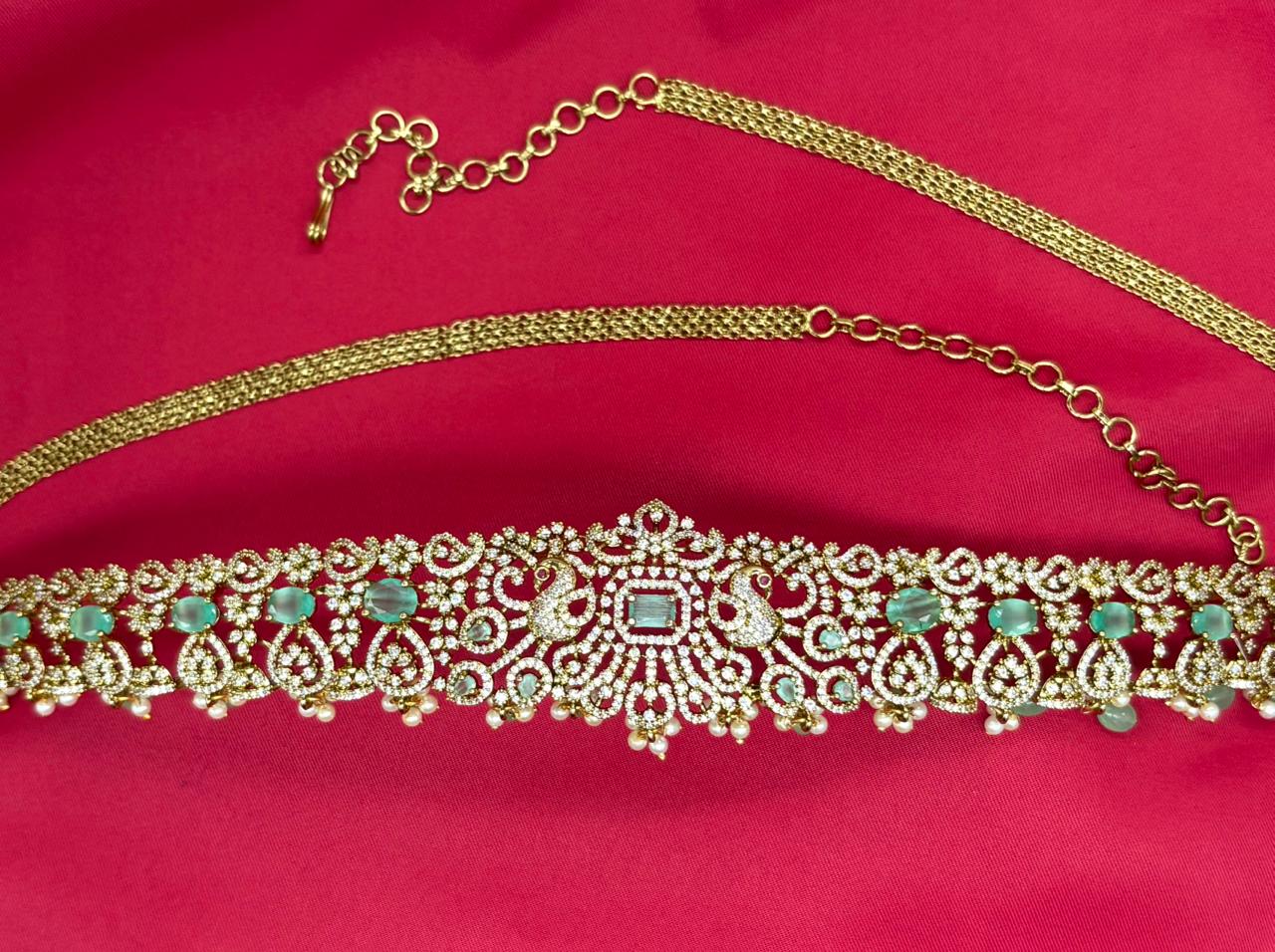 Victorian finishing with Mint-Green stones and peacock deigned Chain Vaddanam