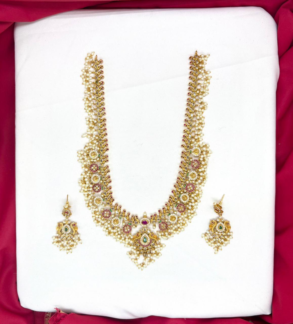 Nakshi finishing with Gold plating with white pearls long