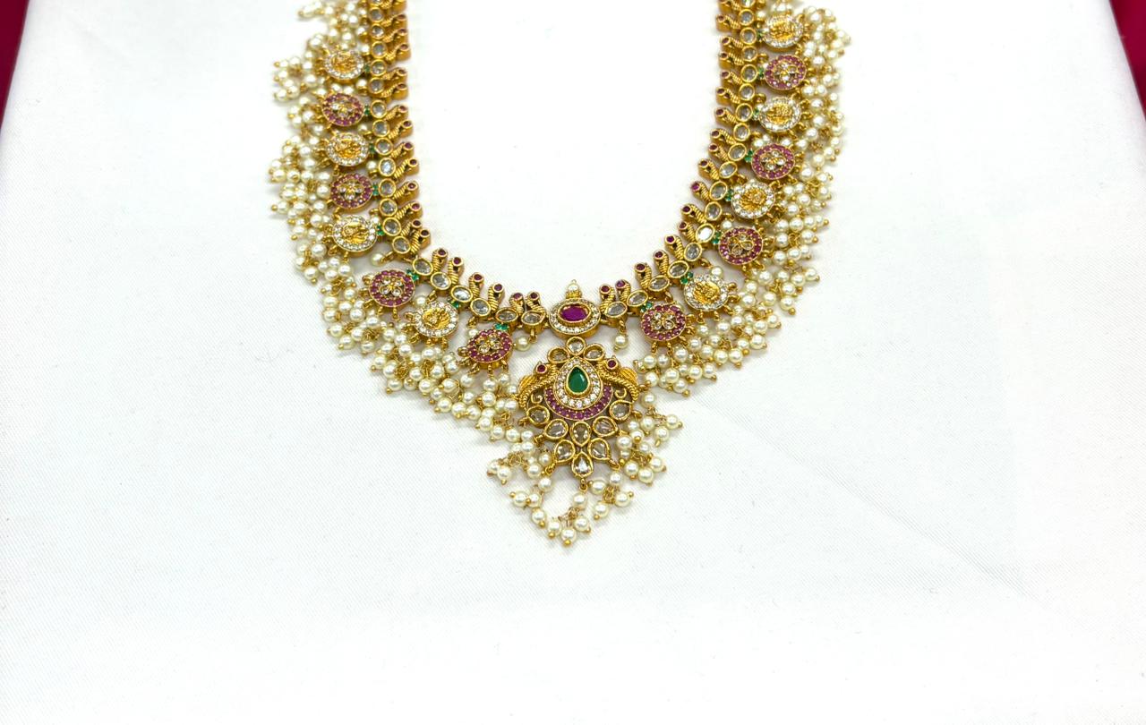 Nakshi finishing with Gold plating with white pearls long