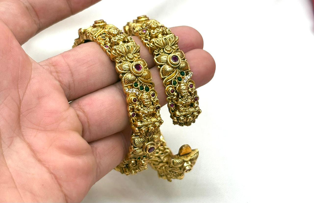 Matte finishing floral motifs with lord lakshmi stones accents