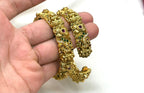 Matte finishing floral motifs with lord lakshmi stones accents