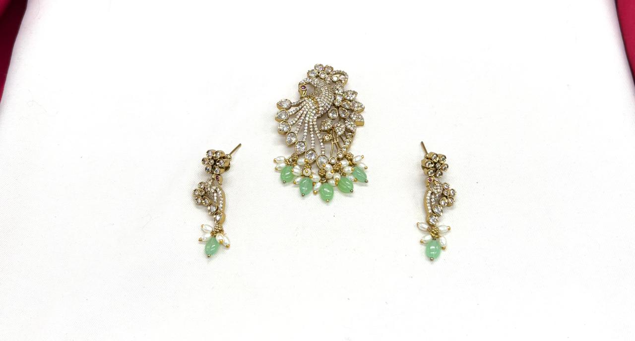 Victorian finishing peacock designed with mint-green monalisa beads Locket