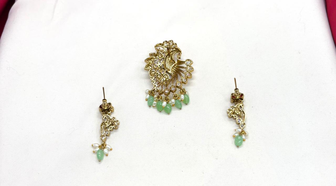 Victorian finishing peacock designed with mint-green monalisa beads Locket