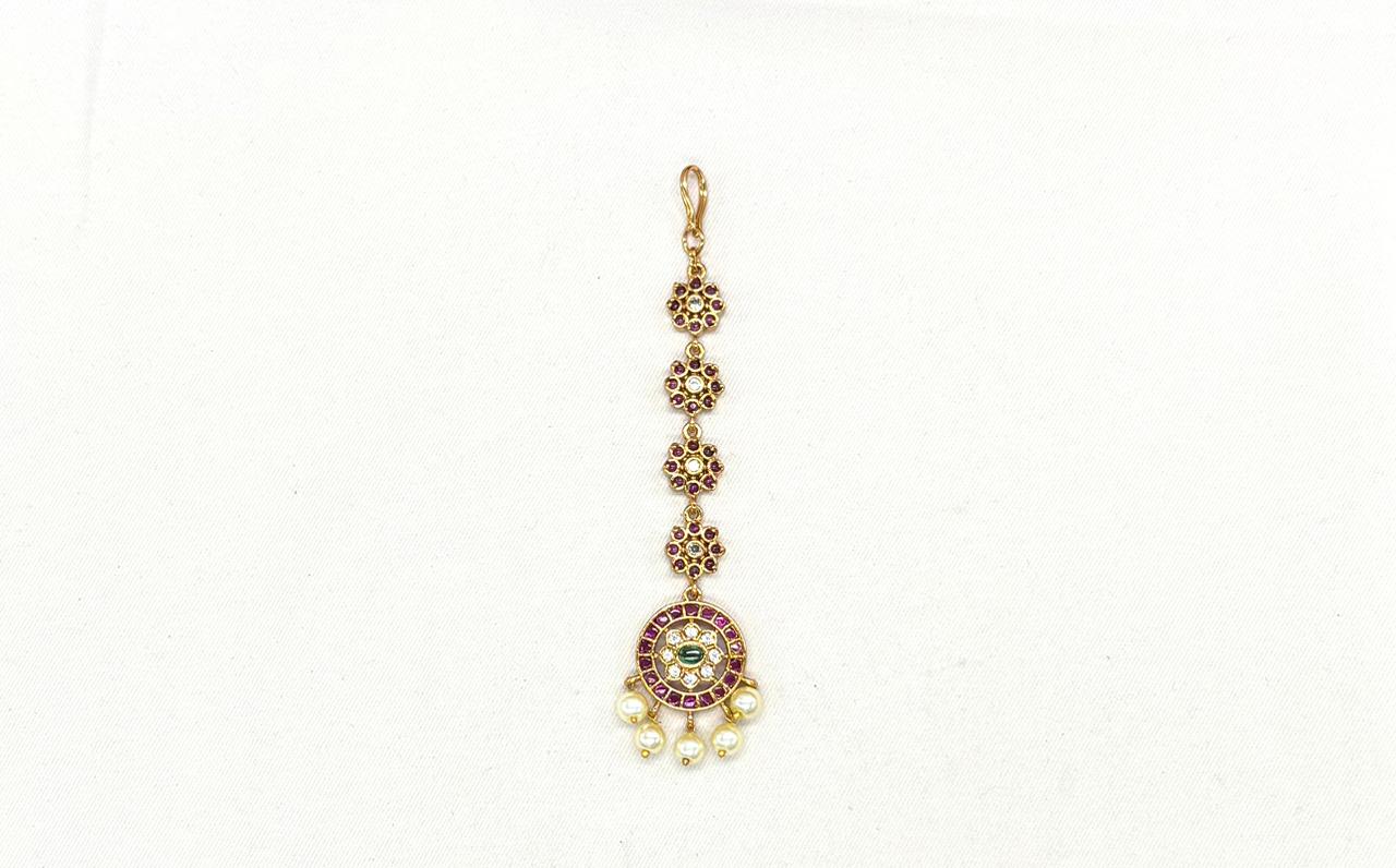Ruby-colored and central green emerald stone pearl drop maang tikka