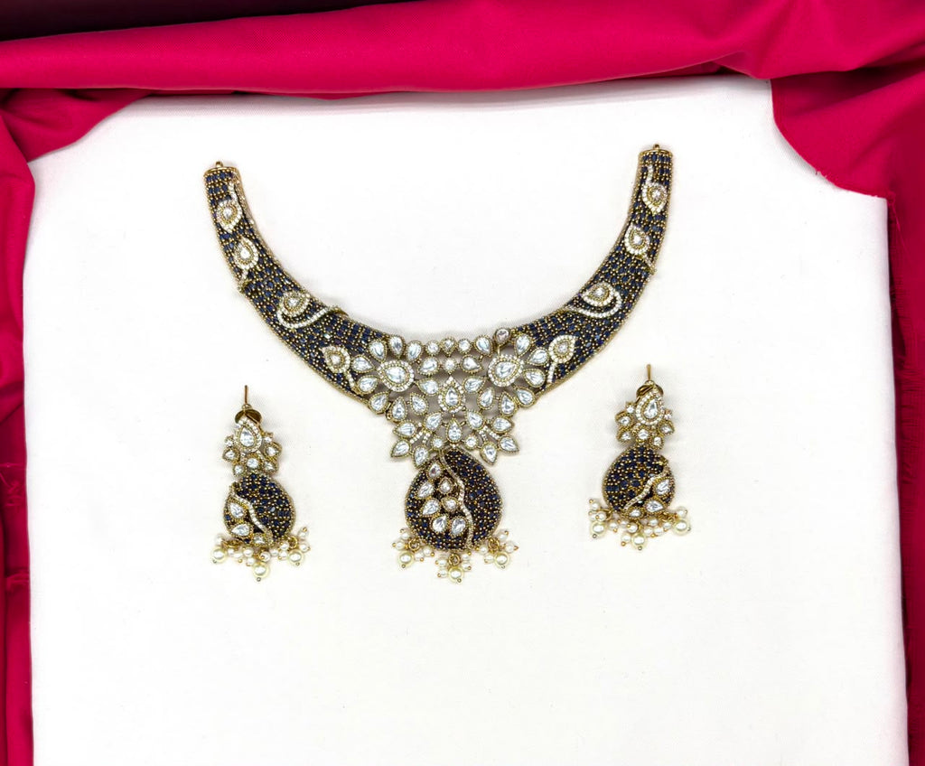 premium features intricate blue bead detailing and prominent kundan stone Necklace