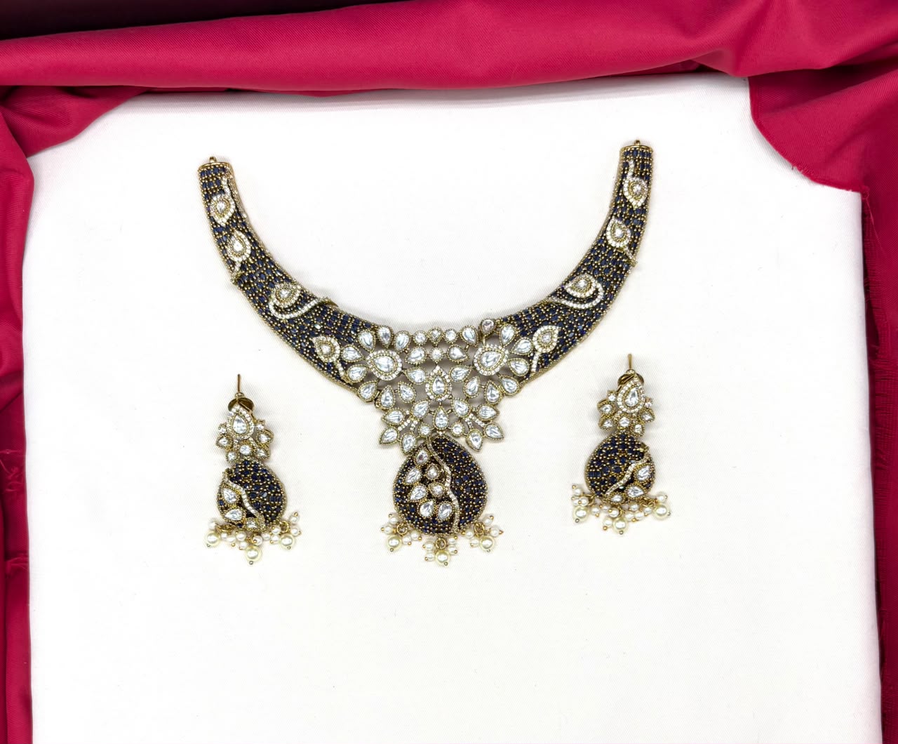 premium features intricate blue bead detailing and prominent kundan stone Necklace