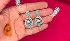 Silver finishing features white rhodium plated zircon withmint- green stones short Necklace