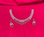 Silver finishing features white rhodium plated zircon with Red stones short Necklace